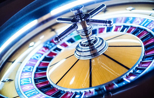 Auto Roulette live dealer studio with HD camera feed and physical spinning wheel
