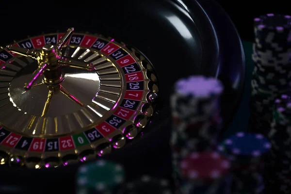 Live blackjack dealer in mataqq studio broadcasting with HD camera and card shoe