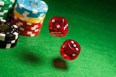 Live dealer conducting Dasar Number game with dice and numbered grid interface